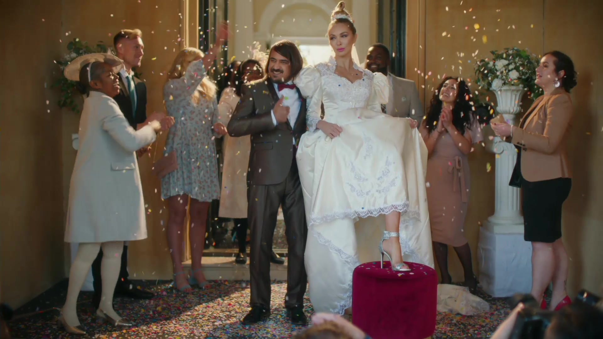 Carl — Carl and towering bride at their wedding with confetti