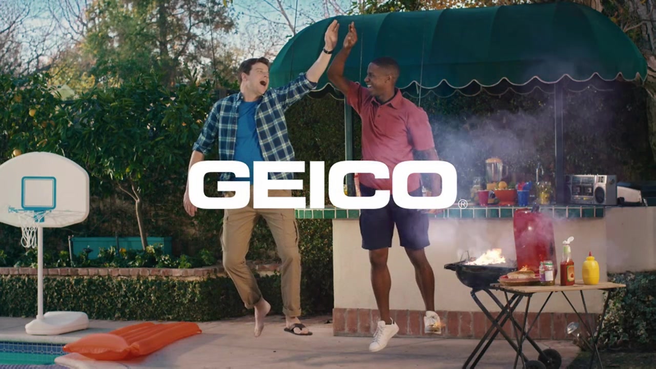 High Five — flames and smoke rise from the barbecue as two men hold their high five